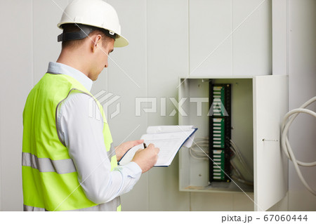Engineer checking the data Engineer checking the data 67060444