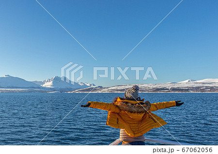 Girl in yellow enjoying the fjord cruise 67062056