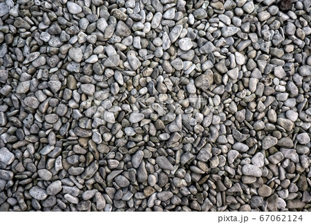 Grey pebbles close up background 67062124