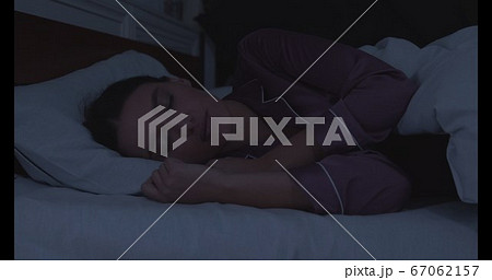 Portrait of millennial woman sleeping in bed 67062157