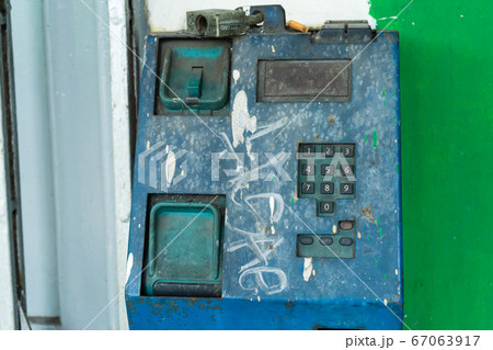 Old broken payphone. Traces of poverty and 67063917