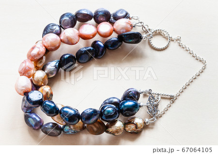 handmade bracelet from dyed river pearls closeup 67064105
