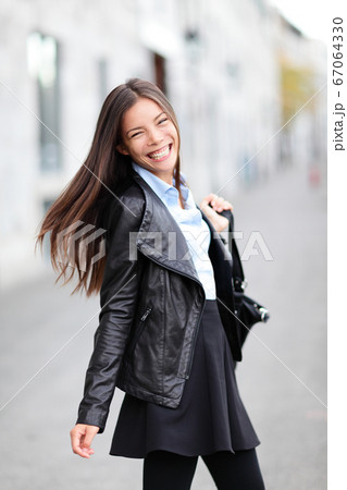 City girl - modern urban woman smiling happy City girl - modern urban woman smiling happy 67064330