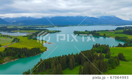 Aerial view over Lake Forggensee at the city of Fuessen in Germany  67064993