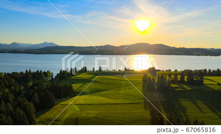 Aerial view over Lake Forggensee at the city of Fuessen in Germany  67065816