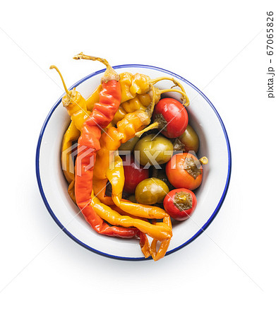 Pickled chili peppers in bowl. Pickled chili peppers in bowl. 67065826