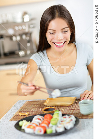 Asian young woman taking healthy lifestyle sushi 67066320