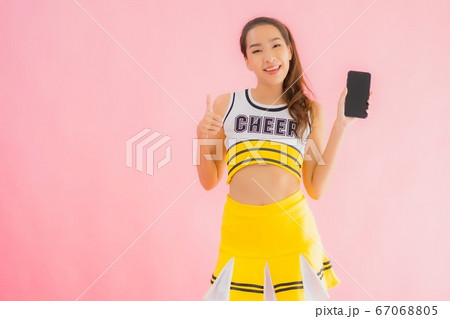 Portrait beautiful young asian woman cheerleader with smart mobile phone 67068805
