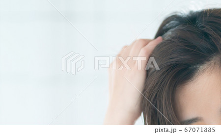 掻き上げる