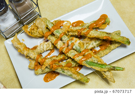 Asparagus fried in batter with romesco sauce Asparagus fried in batter with romesco sauce 67073717