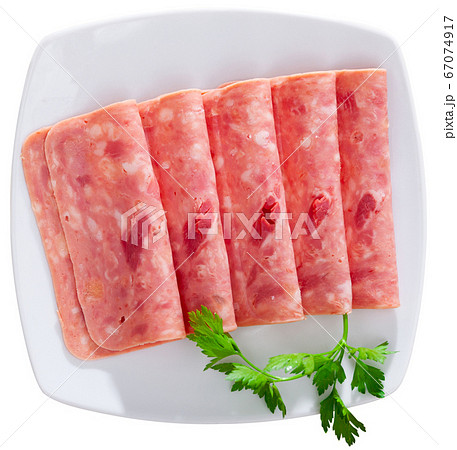 Slices of chopped pork ham sausage isolated Slices of chopped pork ham sausage isolated 67074917