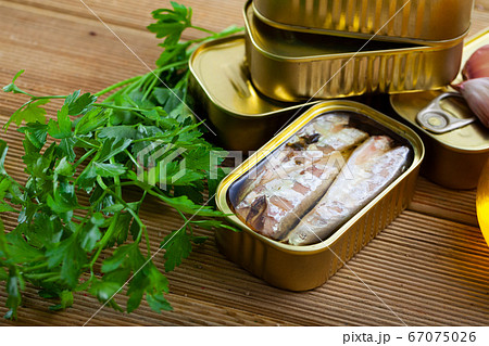 Preserved mackerel fish on wooden table Preserved mackerel fish on wooden table 67075026