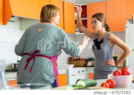 Angry mature female having conflict with unhappy daughter 67075583