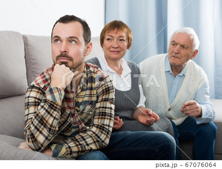 Grandparents and grandson serious talk Grandparents and grandson serious talk 67076064