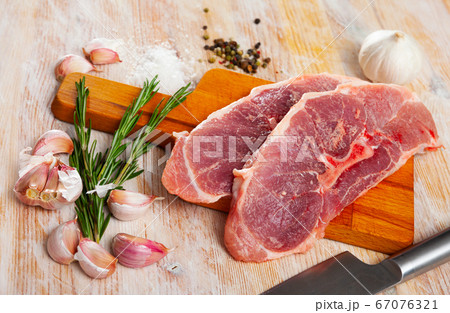 Raw pork shoulder with seasonings 67076321