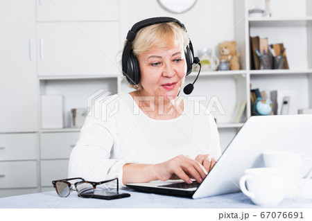 Mature woman communicates via the Internet Mature woman communicates via the Internet 67076691