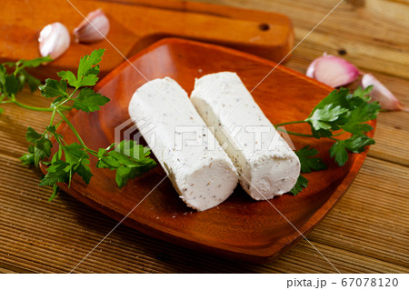 Soft goat cheese with herbs and garlic Soft goat cheese with herbs and garlic 67078120