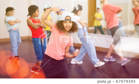 Afro girl hip hop dancer performing at class 67079393