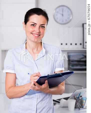 Portrait of adult female in the office 67079654