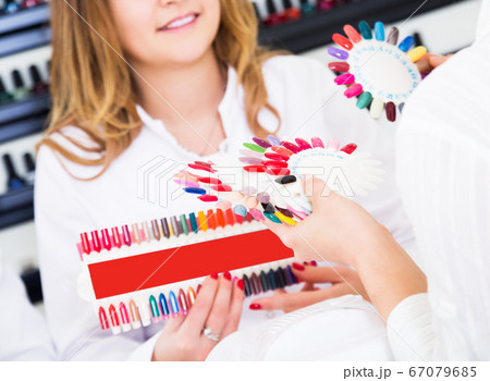 Woman doing manicure Woman doing manicure 67079685