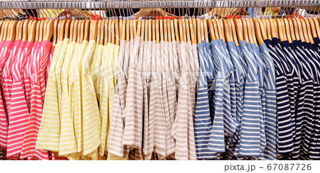 Multi-colored striped T-shirts on hangers 67087726