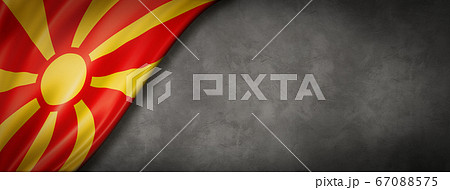 Macedonian flag on concrete wall banner 67088575