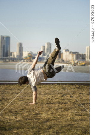 Young man jumping outdoor - sport parkour Young man jumping outdoor - sport parkour 67095635