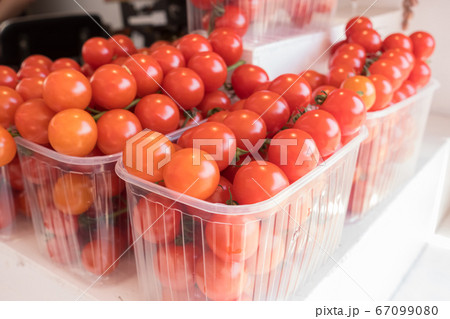 baskets of small red cherry tomatoes baskets of small red cherry tomatoes 67099080