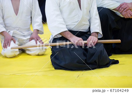 People in kimono on martial arts weapon training seminar 67104249