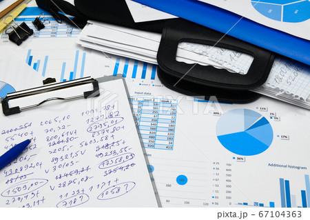 business office desk closeup - financial reports, 67104363