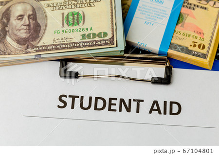 Statement form of student aid and money on the table. 67104801