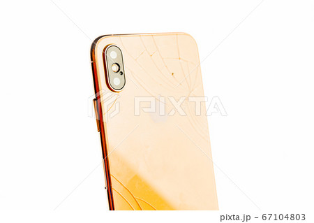 Smashed phone isolated on the white background. Smashed phone isolated on the white background. 67104803