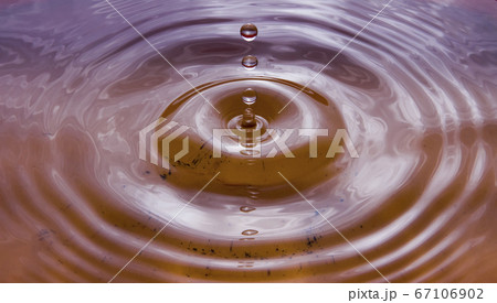 Water droplets falling on the water surface create beautiful ripples Water droplets falling on the water surface create beautiful ripples 67106902