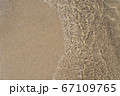 Yellow coarse clear river sand, ripple wave water 67109765