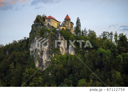 Beautiful view to the Castle of Bled. Bled Castle is a medieval castle built on precipice above the city of Bled in northwestern Slovenia Beautiful view to the Castle of Bled. Bled Castle is a medieval castle built on precipice above the city of Bled in northwestern Slovenia 67112750