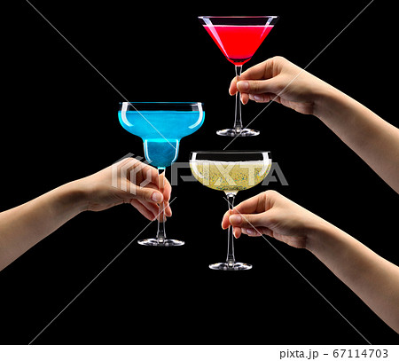 Set of hands holding cocktails isolated on black background Set of hands holding cocktails isolated on black background 67114703