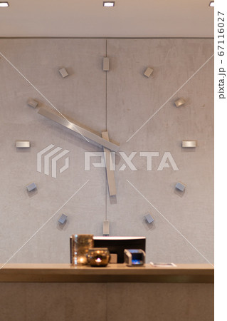 Reception desk in hotel with giant watch at the Reception desk in hotel with giant watch at the 67116027