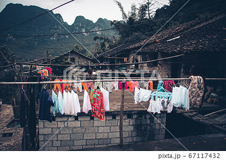 Stilted mud and wood houses of Khuoi Ky rock village built on the karst mountains  in Cao Bang Vietnam shows the old traditions and lifestyle of Vietnamese people 67117432