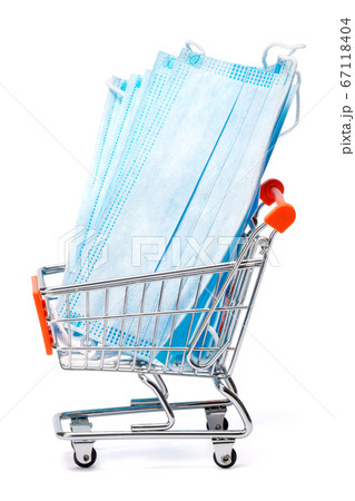 small shopping cart full medical mask isolated on a white background with clipping path small shopping cart full medical mask isolated on a white background with clipping path 67118404
