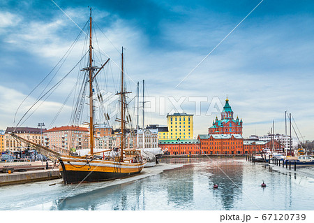 Helsinki harbor district with Uspenski cathedral in winter, Finland 67120739