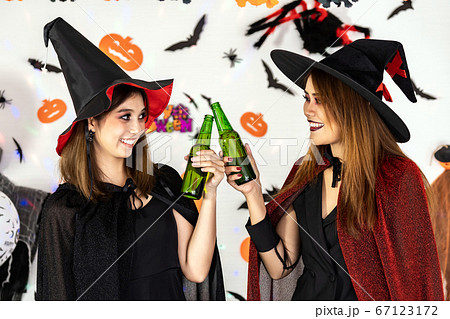 Asian women celebrate cheers in Halloween party Asian women celebrate cheers in Halloween party 67123172