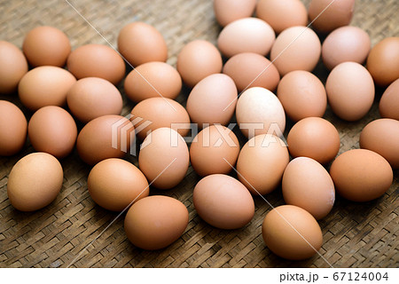 Fresh farm eggs on a wooden background Fresh farm eggs on a wooden background 67124004