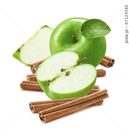 Green cooking apples and cinnamon sticks isolated Green cooking apples and cinnamon sticks isolated 67124580