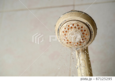stain on shower head background.The water flows slowly stain on shower head background.The water flows slowly 67125295