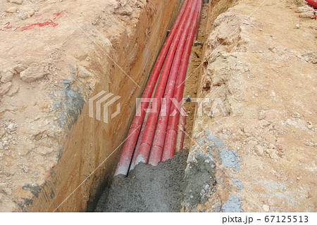KUALA LUMPUR, MALAYSIA -APRIL 06, 2019: HDPE conduit pipe power conduit installed inside the ground trench. It is used to protect underground electrical and telecommunication cable.  67125513