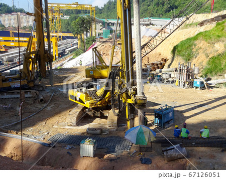 KUALA LUMPUR, MALAYSIA -MARCH 29, 2010: Bore pile rig machine at the construction site. The machine used to driven pile for building foundation work. Operated by skilled workers.  67126051