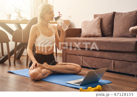 Blonde Caucasian female in a lotus pose 67128155