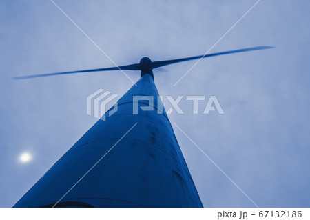 Looking up at a large windmill wind turbine 67132186
