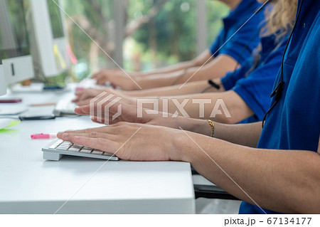 Close up shot of business people hand typing and working 67134177