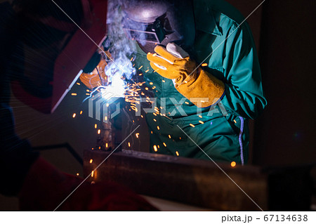 Metal welding steel works using electric arc welding machine 67134638